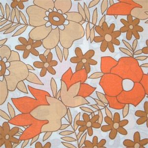 Image shows a close-up of an orange and brown 1970's patterned floral bed sheet