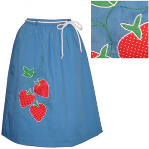 Image shows a 1970's skirt in sky blue, with three strawberries appliquéd on one side