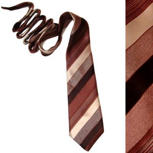 Image shows a striped tie from the 1970's in various shades of brown and beige
